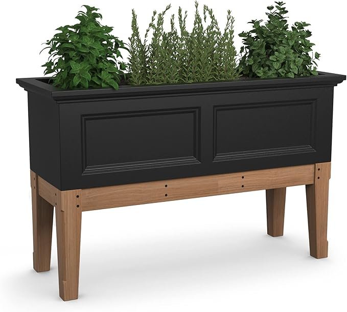 Imagine how beautiful the Mayne Fairfield Elevated Garden Bed would look filled with vibrant flowers, fresh herbs, or lush greenery! 🌿 This 48" L x 18" W x 14" H black planter features durable polyethylene construction and a built-in water reservoir, making it perfect for patios, decks, and backyard spaces. Stylish, low-maintenance, and designed to thrive all season long!