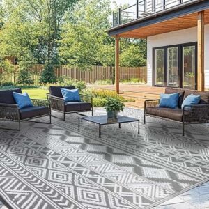 Reversible eco-friendly outdoor rug made from heavy-duty waterproof plastic straw, UV and fade resistant, perfect for patios, RV camping, decks, and balconies