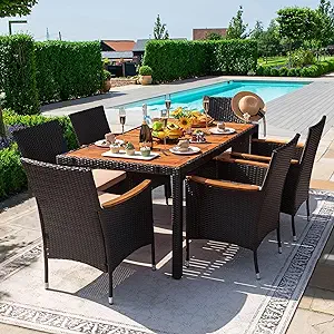 Seven-piece patio conversation set featuring rattan outdoor seating and an acacia wood tabletop, perfect for backyard dining and entertaining.