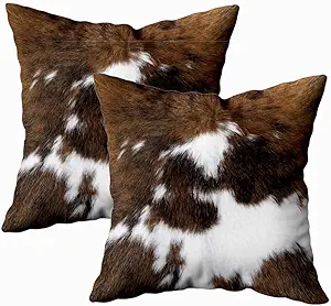 TOMWISH Cow Print Throw Pillow Covers – Set of 2These 18x18 faux cowhide cushion covers offer a stylish Western accent with soft texture and bold pattern. Perfect for tossing onto a leather couch, bed, or boho reading nook to add extra comfort and character.
