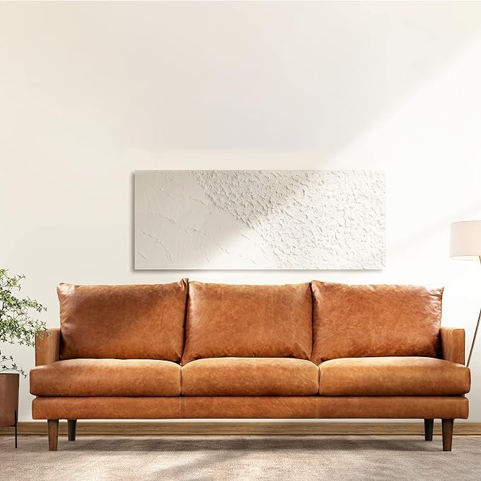 POLY & BARK Girona 88" Leather Sofa – Cognac TanA showstopper in pure-aniline Italian leather, this sofa features a tufted back and feather-down topper for unmatched comfort. The rich cognac tone and clean lines make it a refined yet edgy anchor for any Moto Boho living space.